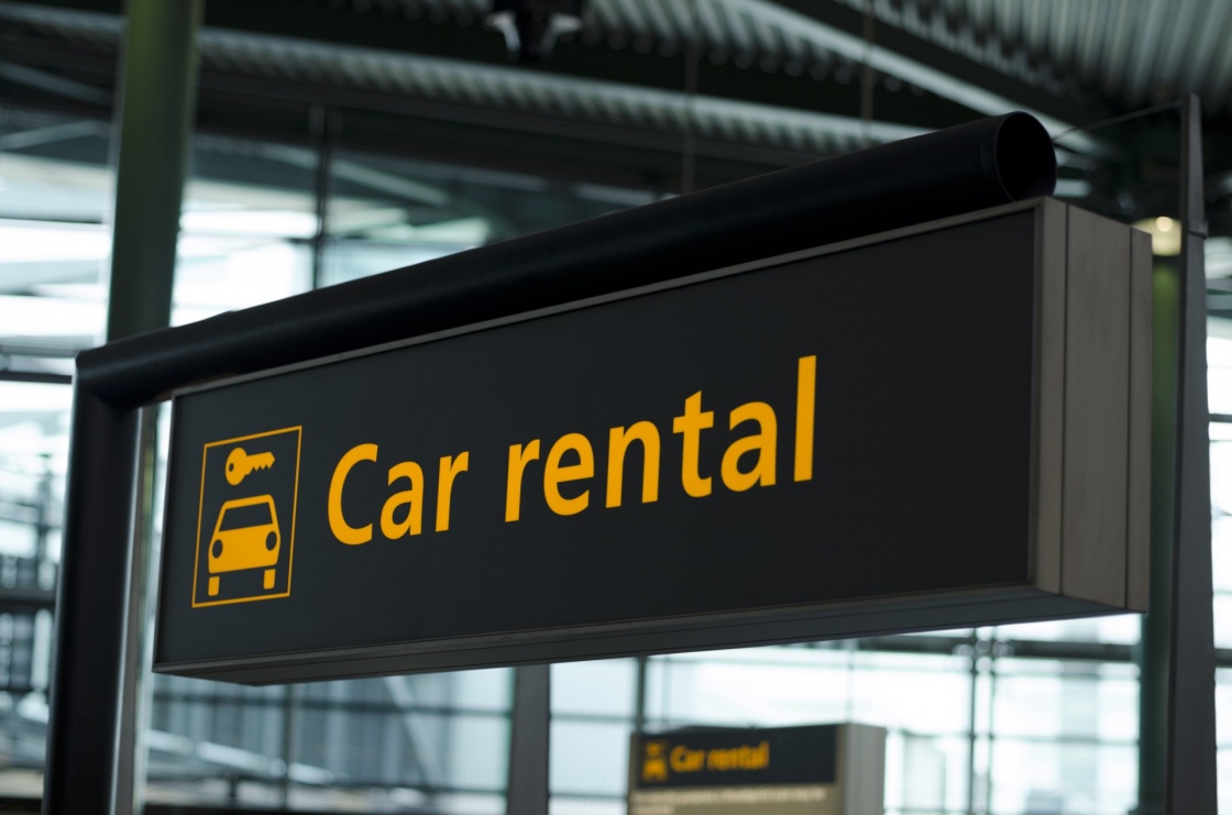 'Sign with direction to car rental' - Crete